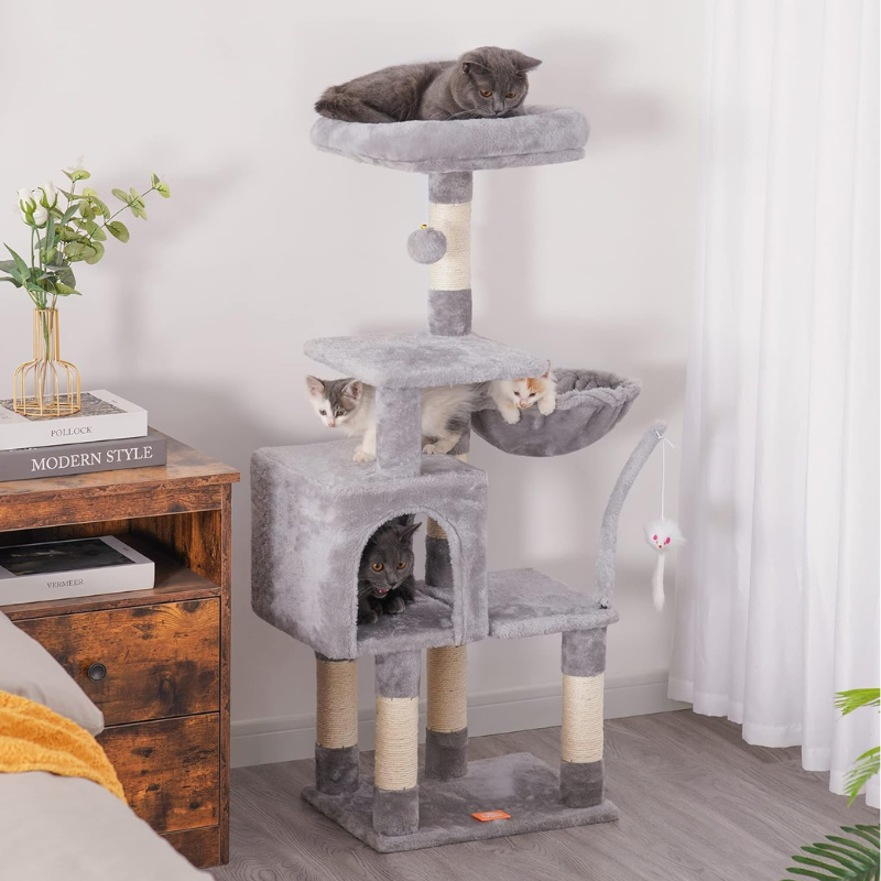 Gray cat tree with cats on it in a room setting