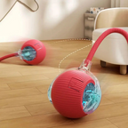 Red robotic ball with a clear cover on a wooden floor, moving towards a white chair.