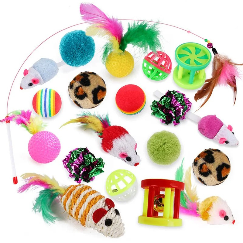 Assorted colorful cat toys on a white background
