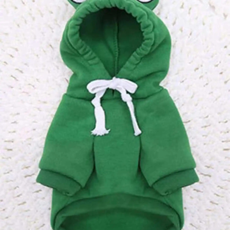 Green frog costume with hood on a textured white background