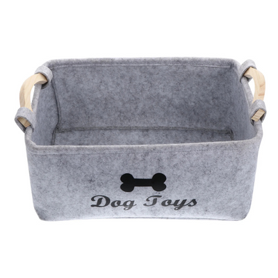 Gray pet toy storage basket with 'Dog Toys' text and bone symbol on a white background