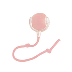 Pink silicone device with a strap on a white background