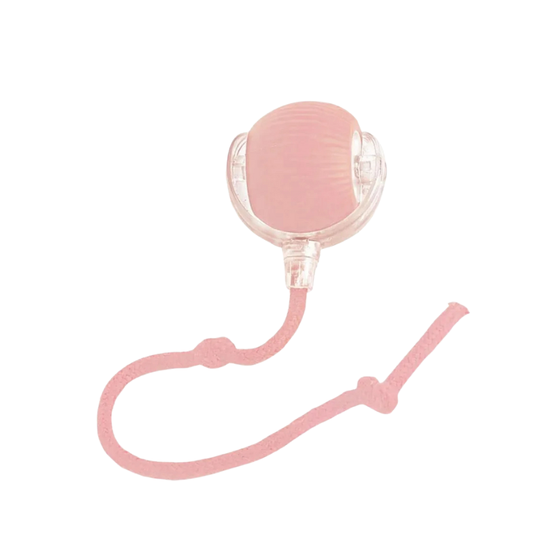 Pink silicone device with a strap on a white background