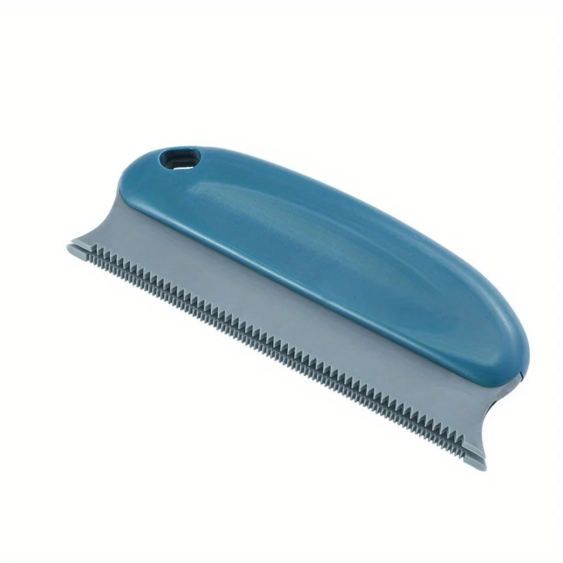 Blue pet grooming brush on a white background