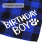 Blue and black checkered fabric with 'Birthday Boy' text and paw print design.