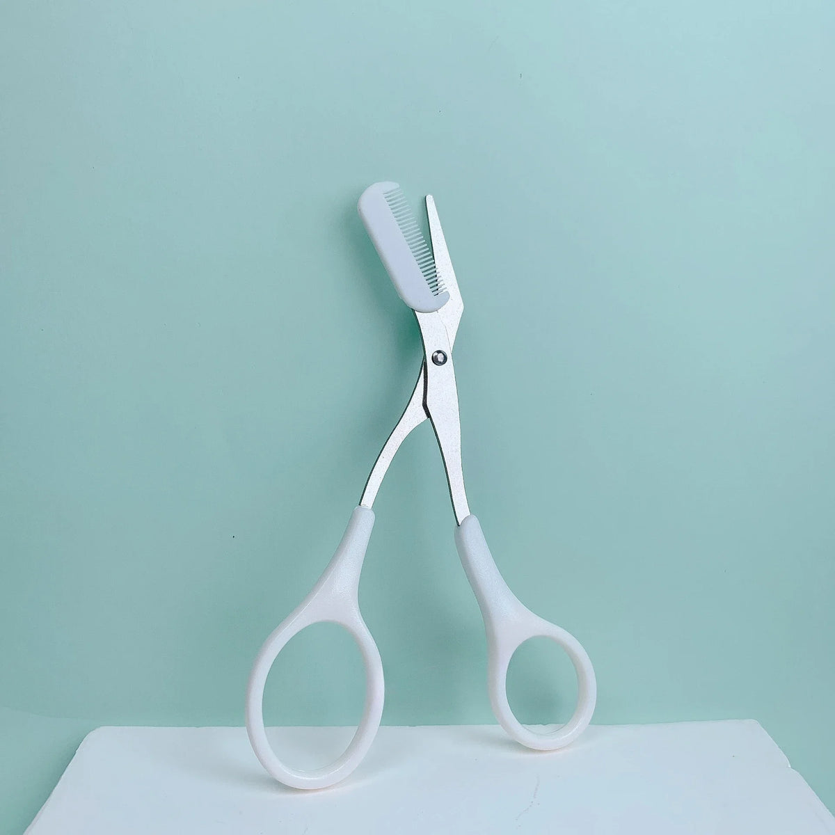 Pink Eyebrow Trimming Scissors – Built-In Comb Grooming Tool