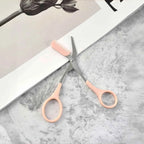 Pink eyebrow trimming scissors with built-in comb - stainless steel, precise grooming tool, creating perfect eyebrows