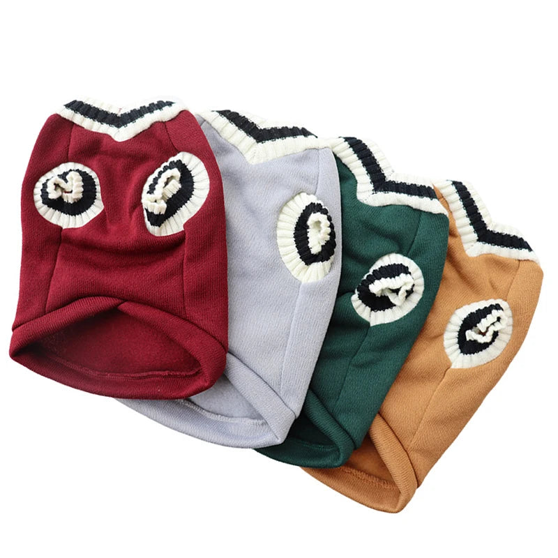 Four beanies in red, gray, green, and brown with decorative patterns on a white background