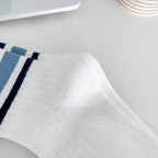 Four pairs of children's socks for spring and autumn, striped versatile style, mid-calf socks with a school style.