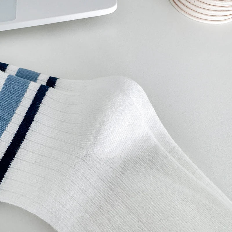 Four pairs of children's socks for spring and autumn, striped versatile style, mid-calf socks with a school style.