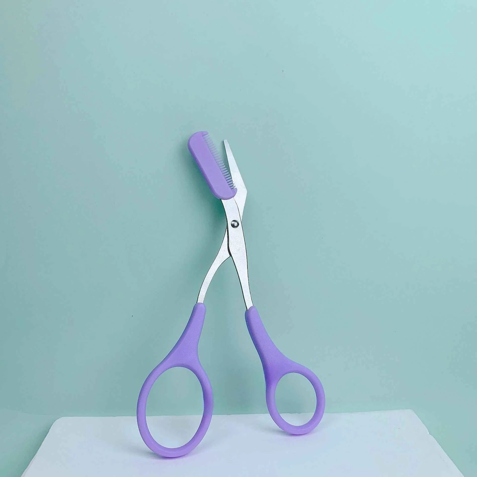 Pink eyebrow trimming scissors with built-in comb - stainless steel, precise grooming tool, creating perfect eyebrows