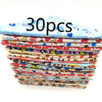 Stack of colorful fabric strips with a visible '30 pcs' label on a white background