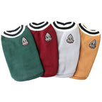 Four dog sweaters in green, red, gray, and brown with embroidered logos on a white background.