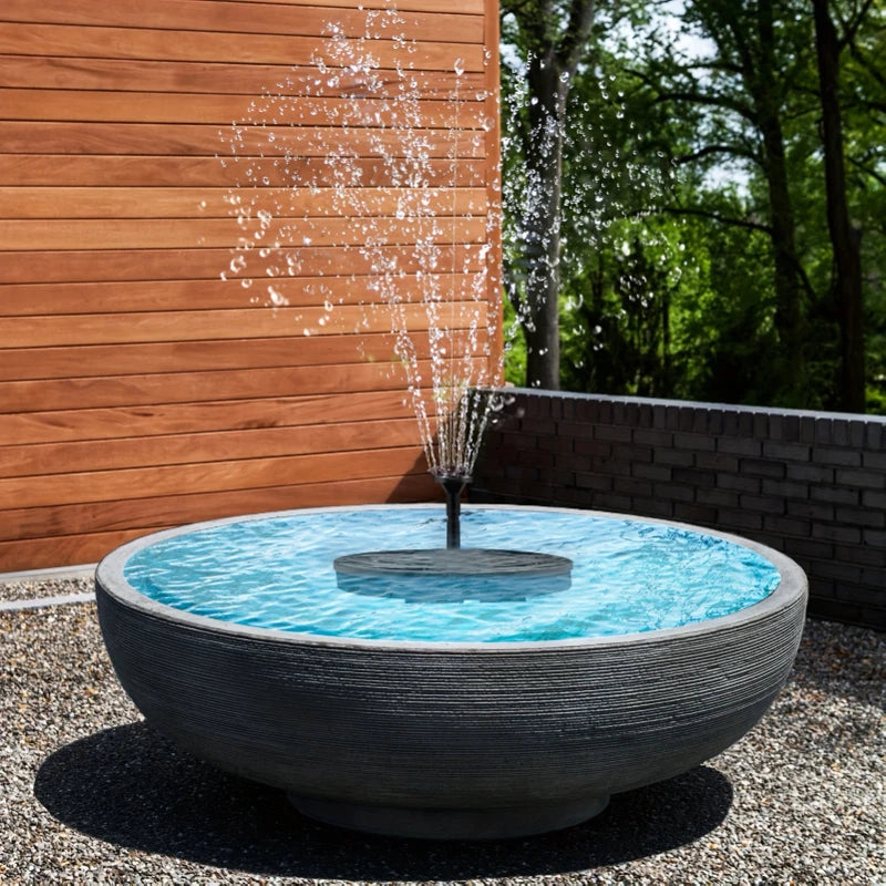 Solar fountain pump floating on water