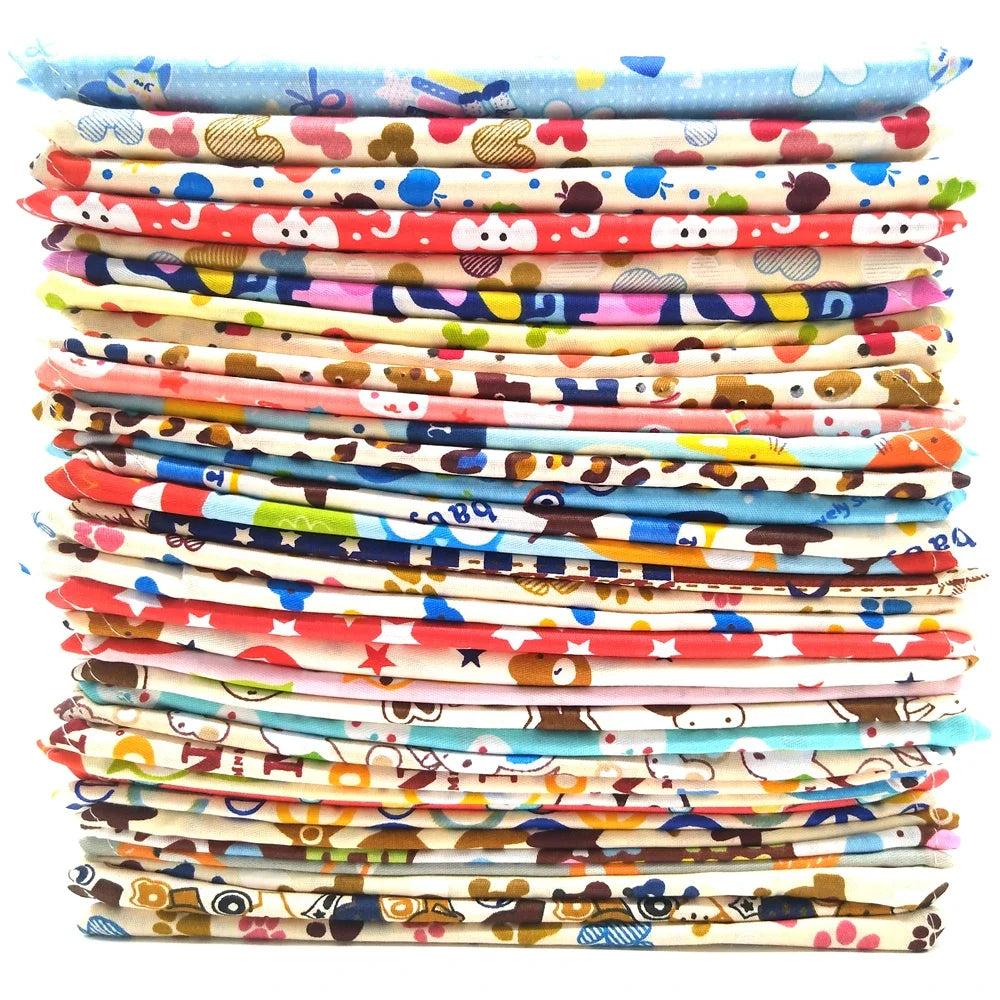 Stack of colorful fabric strips with various patterns on a white background