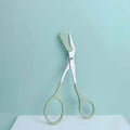 Pink eyebrow trimming scissors with built-in comb - stainless steel, precise grooming tool, creating perfect eyebrows