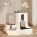 Pet feeding and water station with gray components on a wooden floor.